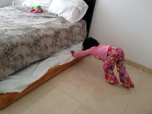 Lanie is a great little helper who loves to do things all by herself. She pushing in her bed like she does every morning after making it. 