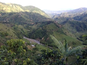 Overlooking the farms. There is an erupting volcano in the far back behind clouds. When it erupted fully many years ago, the rivers you see were lava. 