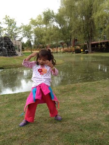 Lanie is imitating the monkeys at the zo