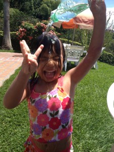 Lanie pouring water on her head. She did this for HOURS!