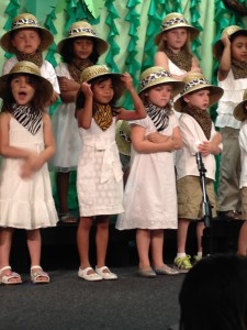 Lanie loved singing in the school musical.  Her hat kept falling off providing lots of entertainment!