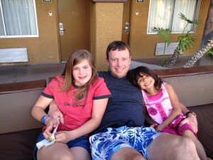 Daddy and his girls hanging out by the pool.